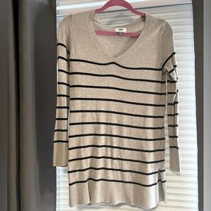 Tan v neck sweater with black stripes